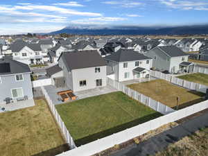 Aerial perspective of suburban area featuring a mountainous background