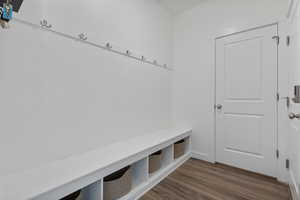 Mudroom with dark wood-style floors