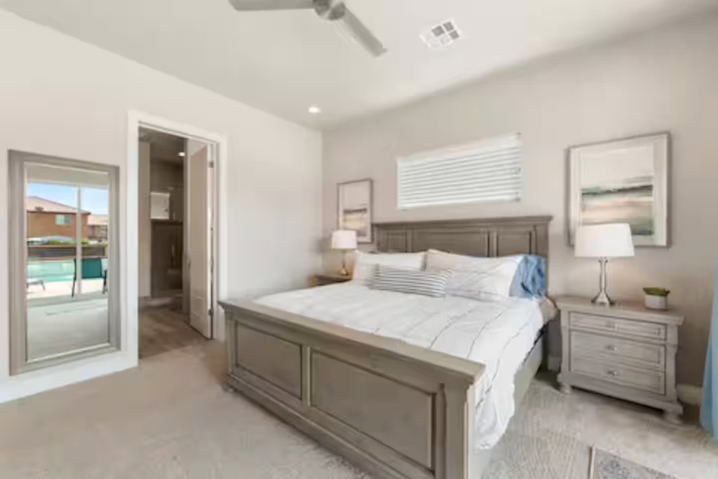 Bedroom with light carpet, ensuite bath, a ceiling fan, and recessed lighting