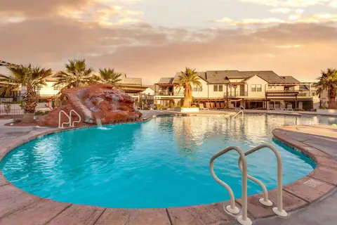 Community pool with a patio