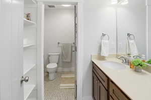 Bathroom with vanity and light tile patterned floors