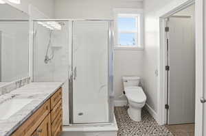ADU Full bathroom featuring a shower stall and vanity