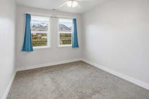 ADU Bedroom featuring a ceiling fan and a mountain view