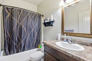 Full bath with vanity and shower / bathtub combination with curtain