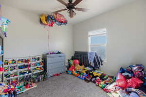 Rec room featuring carpet and ceiling fan