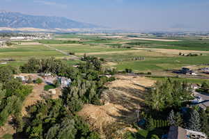 Aerial view of property's location featuring rural landscape and mountains