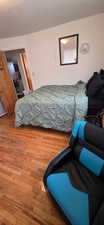 Bedroom with wood finished floors