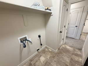 Washroom featuring washer hookup and carpet