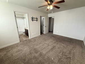 Unfurnished bedroom with carpet, ensuite bath, a textured ceiling, and a ceiling fan