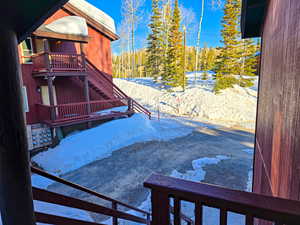 Exterior space with stairway and a balcony
