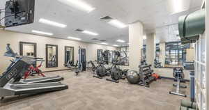 Workout area with a heating unit and a drop ceiling
