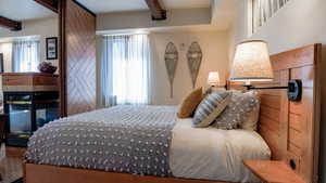 Bedroom with beamed ceiling