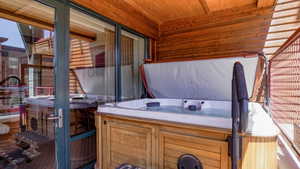 View of patio / terrace with a hot tub