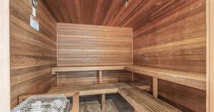 Sauna with wood walls and wood ceiling