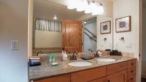 Bathroom featuring double vanity