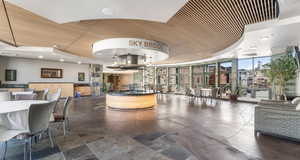 Reception area with recessed lighting, expansive windows, and wood ceiling