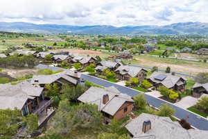 Aerial perspective of suburban area with a mountainous background