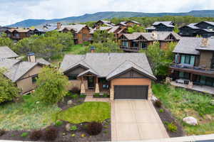 Aerial view of residential area featuring mountains
