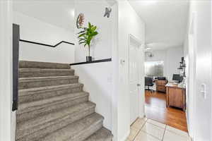 Staircase featuring tile patterned floors