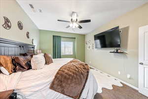 Bedroom featuring carpet floors and a ceiling fan
