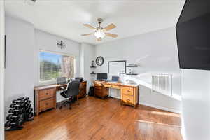 Office featuring wood finished floors and a ceiling fan