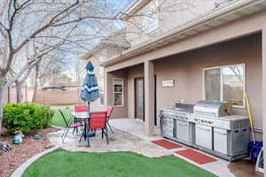 View of patio / terrace with a grill and a sink