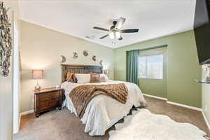 Bedroom with carpet flooring and a ceiling fan