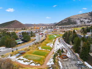 Snowy aerial view featuring a mountain view