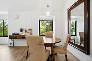 Dining area featuring wood finished floors and healthy amount of natural light
