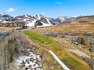 View of mountain background featuring a golf course