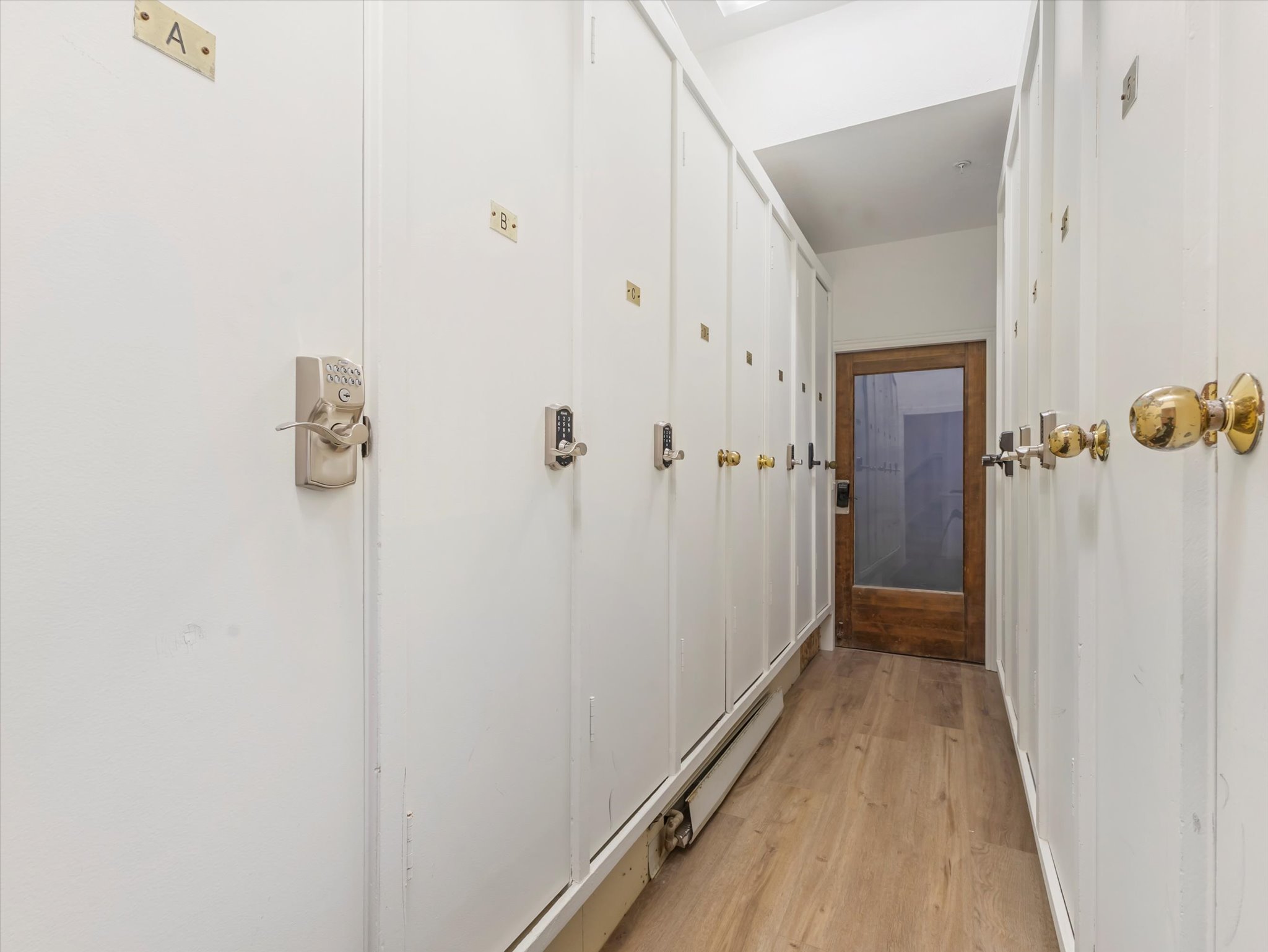 Hallway with light wood-type flooring