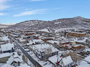 Snowy aerial view featuring a mountain view