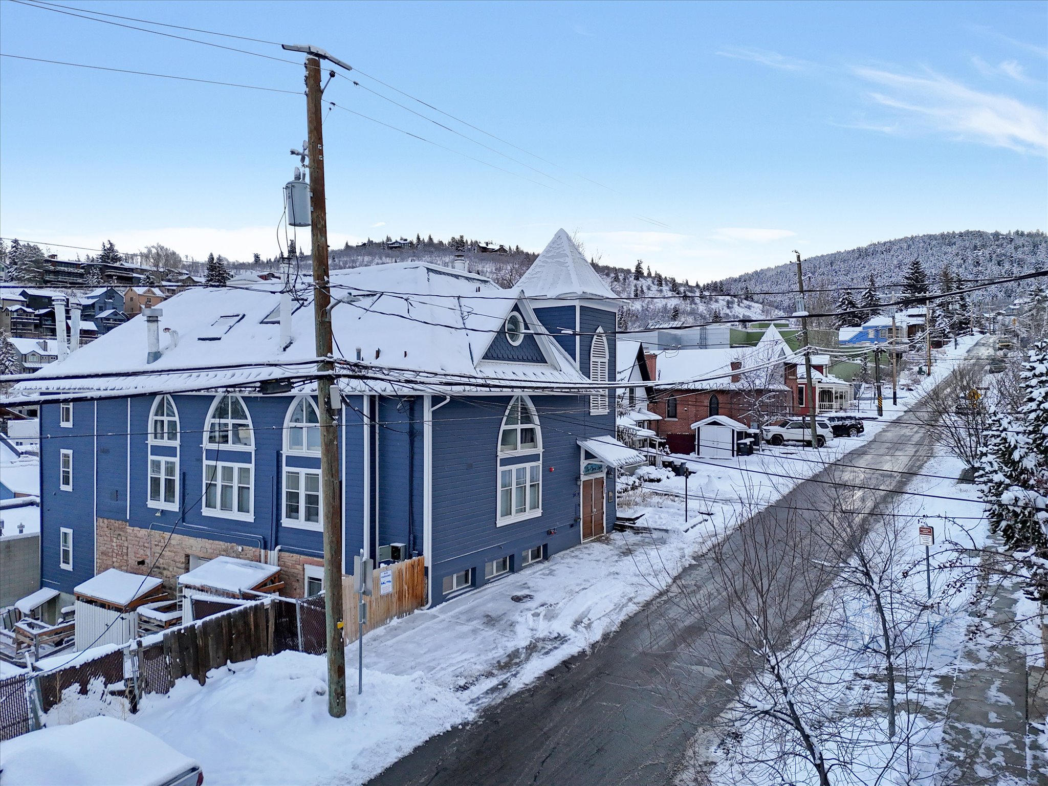 Snow covered property featuring a mountain view