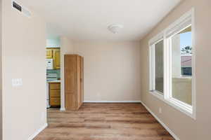 Empty room featuring light wood-style floors and baseboards