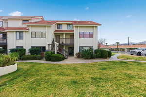 View of property with stairs