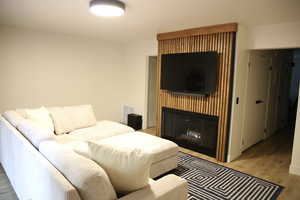 Living area featuring a fireplace and light wood-type flooring