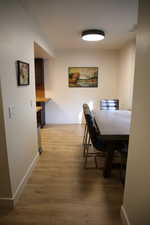 Dining area featuring baseboards and light wood-style flooring