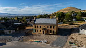 View of front of property with a mountain view and a residential view