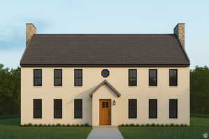 Colonial house featuring a chimney, a front lawn, and brick siding