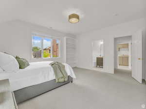 Bedroom with carpet floors and ensuite bath