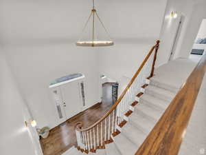 Foyer entrance featuring stairway and wood finished floors