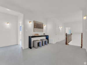 Unfurnished living room featuring carpet flooring