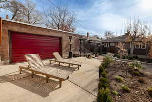 View of patio featuring a garage