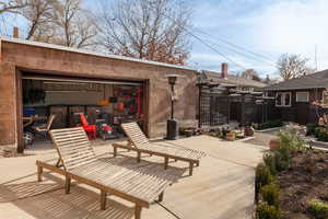View of patio / terrace featuring a garage