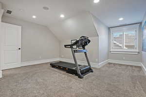 Bedroom/Exercise area featuring recessed lighting, light colored carpet, and vaulted ceiling