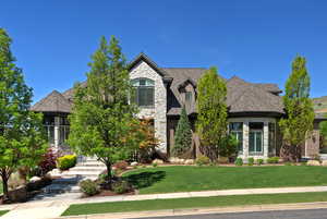 Front of home with stone and brick siding