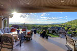 View of patio / terrace with a mountain view, an outdoor living space, and area for grilling