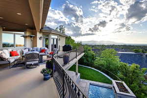 Balcony featuring an outdoor living space, grilling area, and a mountain view