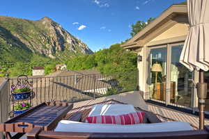 Wooden terrace featuring a mountain view