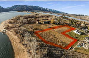View of property location featuring property parcel outlined and a water and mountain view